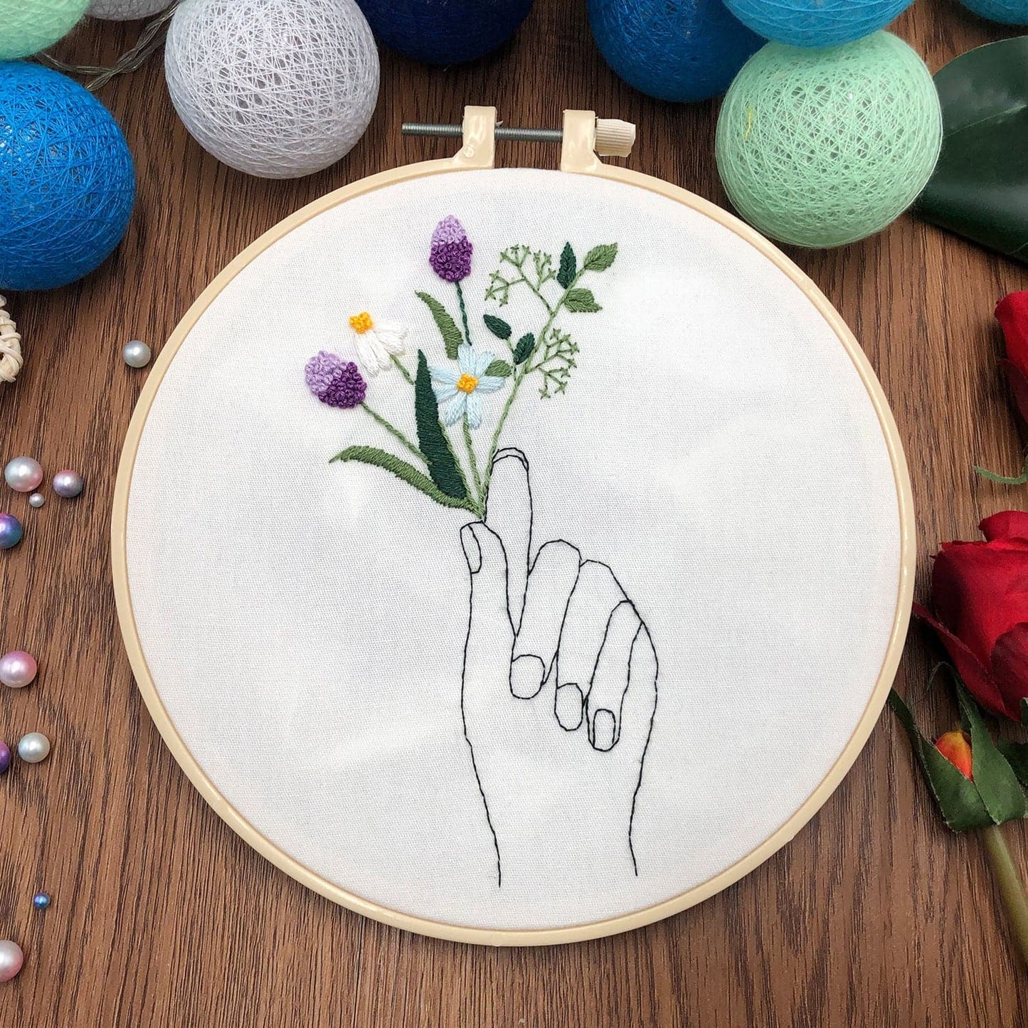 "The hand that holds the flower" - embroidery ktclubs.com
